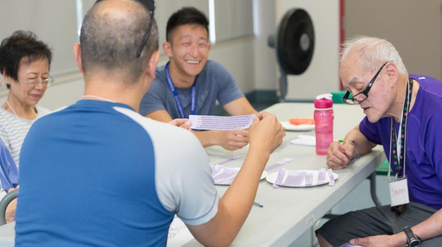 Volunteers socializing and smiling at a Minds in Motion session.