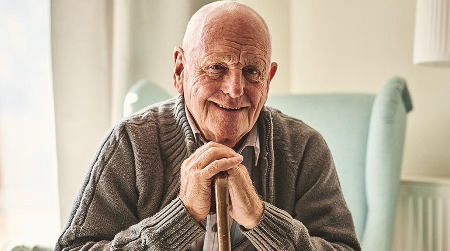 Smiling senior man at care home.