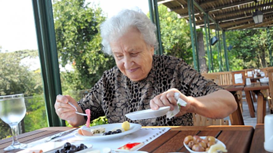Senior woman having a delicious meal.