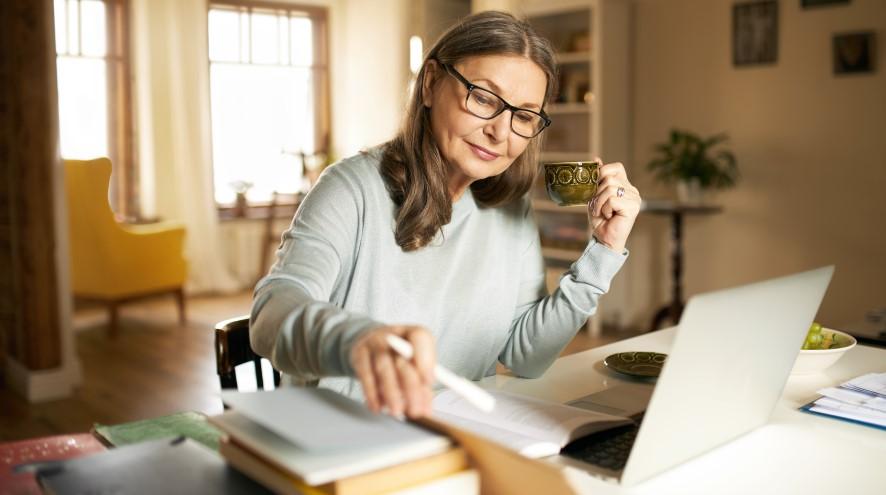 Middle-aged woman on her laptop.