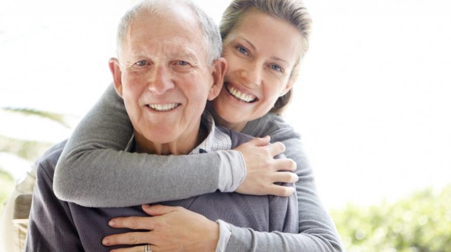 Father and daughter smiling.