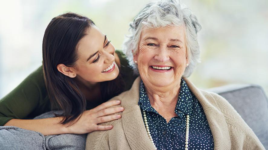 Senior woman smiling with her daughter.