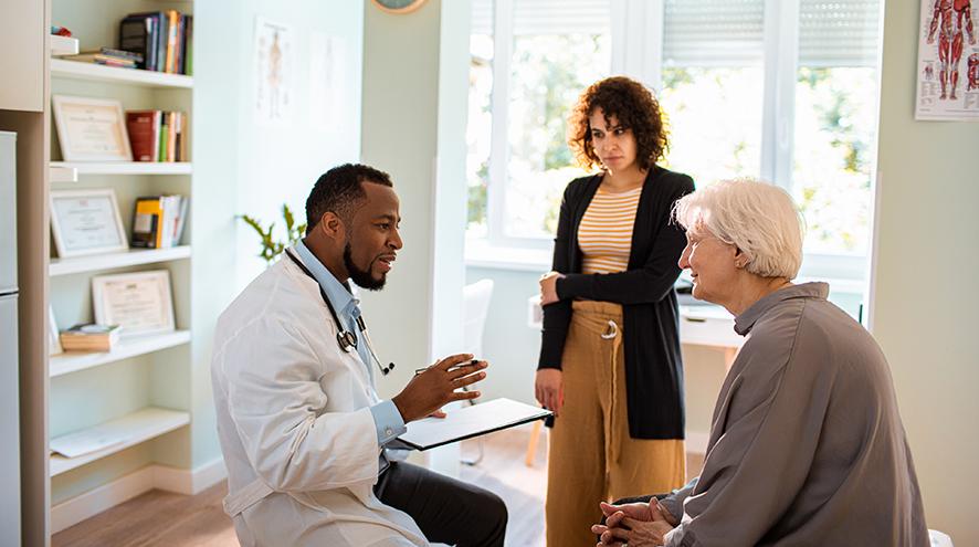 At the doctor's office, with a patient and a family member.